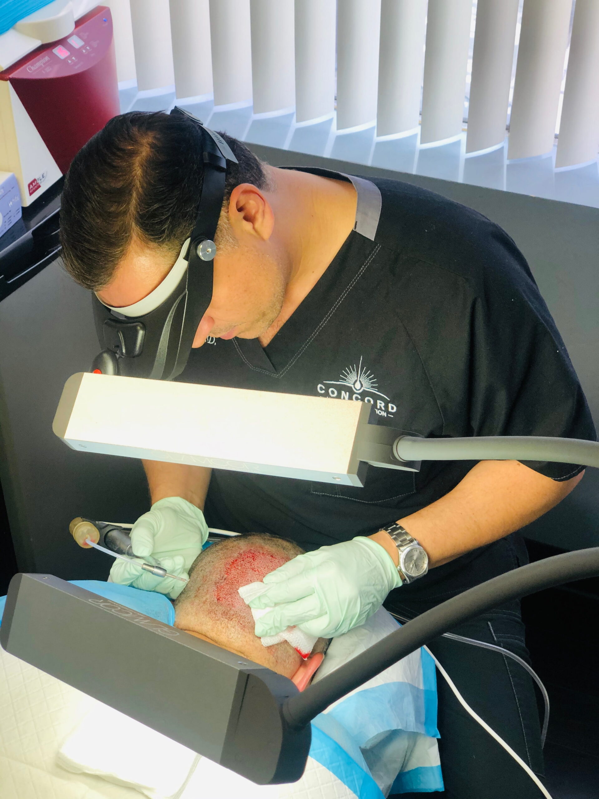 Dr. Ben doing a hair transplant